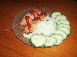 Grilled Meat Skewers with Fresh Vegetables photo