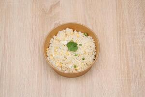 Simple Cantonese rice Cantonese shrimp rice in paper takeout container photo