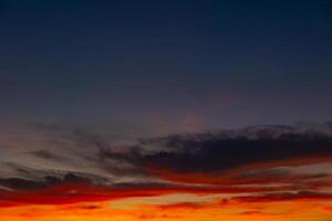 orange clouds at sunset. Partly cloudy sky photo
