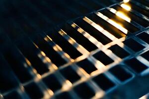 Abstract close-up of a metal grill texture, creating a modern and industrial background ideal for graphic and web design photo