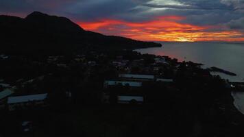 Drone view Beautiful evening sunset fiery skies over Camguin island Philippines video