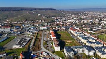 Drone Flying Over Industrial Rooftops Toward Vineyards in Epernay, France video