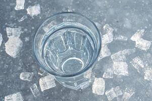 Beautiful transparent different pieces of ice on the ice surface. Pieces of ice filled with bubbles, a solid background. dishes, frozen water is clean. High quality photo