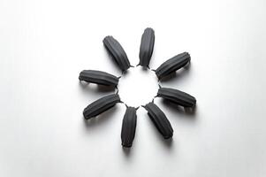 A herd of gypsum black bison stand in a circle. Abstract background isolated figures for interior. High quality photo