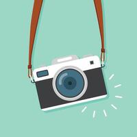 A camera hanging from a strap on a green background vector