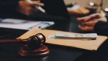 A judge's gavel and money on a desk video