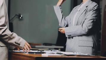 Two business people talking at a desk video
