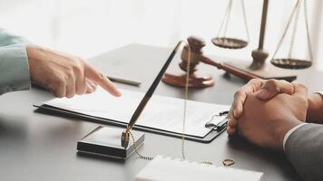 A lawyer and a client at a desk video