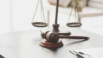 Law and justice concept with gavel and scales of justice on table video