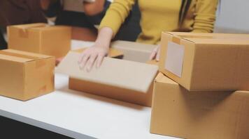 A woman is packing boxes on a table video
