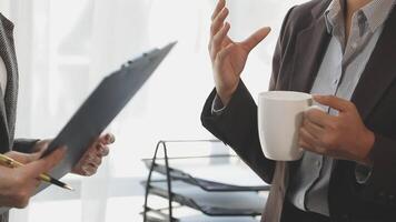 Two business people talking in an office video