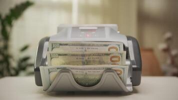 Dolly Zoom on Money Counting Machine with Stacks of US Dollars video