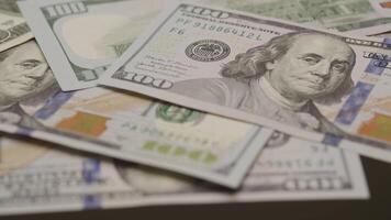 Close-up of scattered 100 US dollar bills video