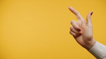 Hand Gesture Pointing on Yellow Background video