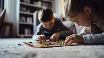 Two children playing a board game on the floor photo