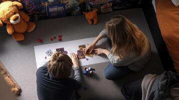 Two children playing with a board game photo