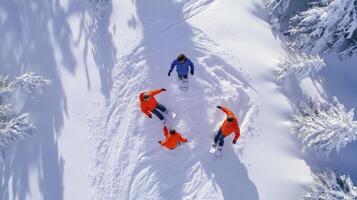 Three people in orange jackets are standing on snow photo