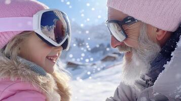 A little girl and an older man wearing ski goggles photo