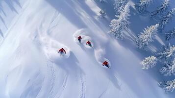 Three people are skiing down a snowy slope photo