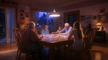 A family playing a board game at night photo