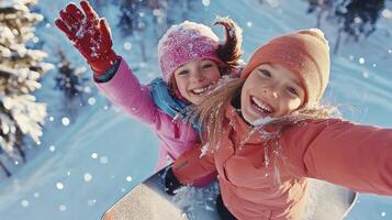 Two girls are smiling while riding a snowboard photo