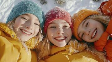 Three girls in winter clothes smiling and posing for the camera photo