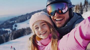A man and a young girl taking a selfie on a snowy slope photo