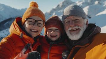 An older man and woman with their two children in the snow photo