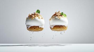 Two dessert cakes with whipped cream and mint leaves photo