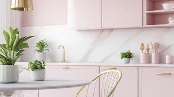 A pink kitchen with gold accents and a marble table photo