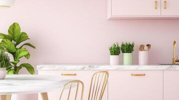 A pink kitchen with gold accents and a marble table photo
