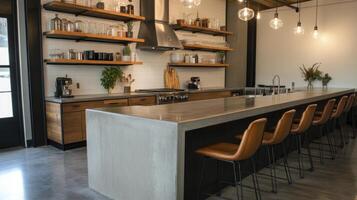 A kitchen with a long counter and a bar photo