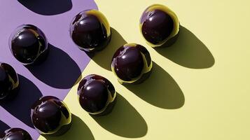 A group of chocolate eggs on a yellow and purple background photo