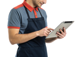 man in blue and red polo shirt and apron uses tablet, showcasing intersection of food and technology in modern setting png