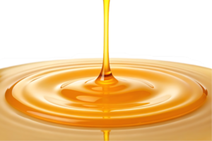 Golden liquid pouring, creating concentric circles. png