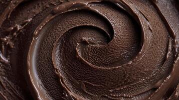 Chocolate ice cream with rich creamy texture and smooth swirls in close up view photo