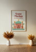 A Ramadan Mubarak frame mockup featuring a mosque illustration hangs on a wall flanked by pampas grass arrangements psd