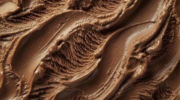 Chocolate ice cream with rich creamy texture and smooth swirls in close up view photo
