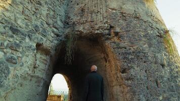 Elderly Man Tourist Observes The Tunnel Inside An Ancient Defensive Castle video
