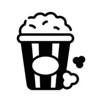Look at this handy glyph style icon of popcorn bucket. vector
