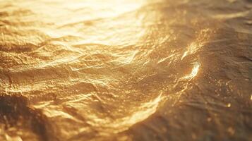 Textured gold surface with shimmering highlights, capturing light and shadows on crumpled material. Abstract and elegant background. photo