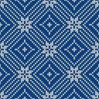 Winter knitted pattern. Nordic ethnic style ornament with snowflakes and rhombus, blue and white. Holiday background. Diamond pattern seamless texture. vector