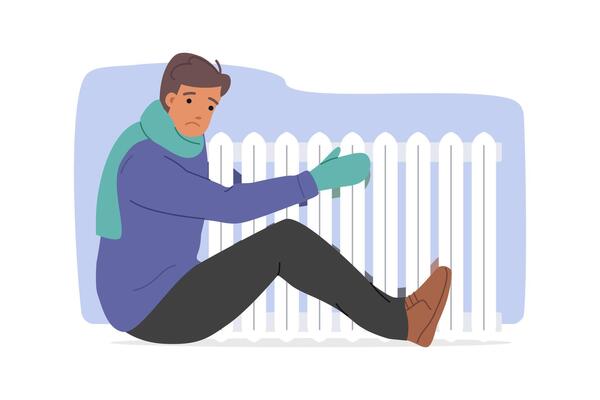 Freezing man hugs radiator to escape cold due to sharp drop in temperature in apartment