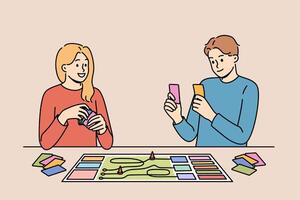 Happy couple playing board game while spending free time together and having fun after working day vector