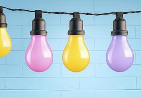 Colorful light bulbs hanging on a string photo