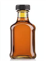 A bottle of maple syrup isolated on a white background photo