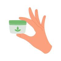 Hand holding a small jar of organic cream with a green lid and leaf symbol. Illustration emphasizing natural skincare products and minimalist design. vector