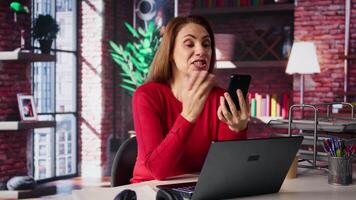 Mature woman engaging in virtual workshop to learn new skills for job, interacting with the coach. Ambitious person joining interactive web learning session for personal development. Camera B. video