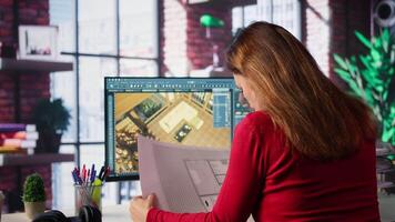 Graphic artist uses architectural software and blueprints to create 3D render of a home interior. Program allows to configure furniture and other design elements for a virtual layout. Camera B. video