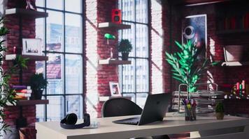 Stylish empty desk in a high end loft apartment workspace, modern interior blends glass and neutral tones for a refined atmosphere with upscale design elements and timeless elegance. video